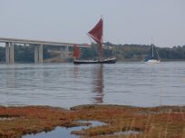 Sail boats sailing through Orwell bridge