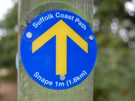 A close-up of a Suffolk Coast Path Waymark Disc