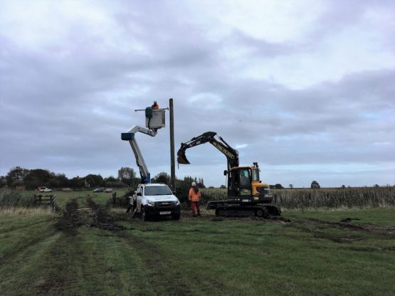 Pole being removed by workers